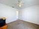 Comfortable bedroom with carpet, light walls, and easy access to the rest of the house at 2112 White Eagle St, Clermont, FL 34714