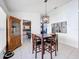 Bright dining area features tile flooring, modern light fixture, and access to the kitchen at 2112 White Eagle St, Clermont, FL 34714