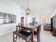 Bright dining area features tile flooring and modern light fixture, and open access to the living area at 2112 White Eagle St, Clermont, FL 34714