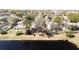 A well-maintained single Gathering home with a screened in patio and fenced yard, located near a pond at 2112 White Eagle St, Clermont, FL 34714