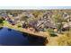 A lovely home with a screened in patio and white fence is close to the nearby pond at 2112 White Eagle St, Clermont, FL 34714