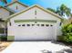 Close up of garage door on single-story home featuring a two-car garage at 2112 White Eagle St, Clermont, FL 34714