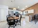 Bright kitchen with stainless steel appliances and breakfast bar with black wood bar stools at 2112 White Eagle St, Clermont, FL 34714