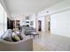 Spacious living room features neutral color palette, tile flooring and lots of natural light at 2112 White Eagle St, Clermont, FL 34714