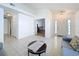 Bright living room featuring tile floors, neutral walls and view of front entrance and bedroom at 2112 White Eagle St, Clermont, FL 34714