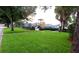Community playground and play area with slide, fenced in for safety, and surrounded by green lawn at 2112 White Eagle St, Clermont, FL 34714