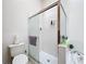 Well-lit bathroom featuring glass enclosed shower, soaking tub and tiled walls at 2112 White Eagle St, Clermont, FL 34714