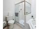 Well-lit bathroom with a glass enclosed shower and a separate soaking tub at 2112 White Eagle St, Clermont, FL 34714
