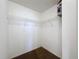 Small walk-in closet with wire shelving and neutral carpet at 2112 White Eagle St, Clermont, FL 34714