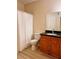 Well-maintained bathroom with a single vanity, updated fixtures, and a shower with curtain at 2624 Robert Trent Jones Dr # 633, Orlando, FL 32835