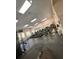 Modern gym with treadmills, exercise bikes, and weight-lifting machines for resident fitness and well-being at 2624 Robert Trent Jones Dr # 633, Orlando, FL 32835