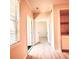 Hallway featuring neutral walls, hardwood floors, built-in shelving, and multiple doorways at 2624 Robert Trent Jones Dr # 633, Orlando, FL 32835