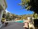 Serene community pool surrounded by palm trees offering a luxurious outdoor experience at 2624 Robert Trent Jones Dr # 633, Orlando, FL 32835