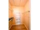 Spacious walk-in closet featuring hardwood floors, shelving, and ample storage space at 2624 Robert Trent Jones Dr # 633, Orlando, FL 32835