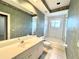 Bathroom with wallpaper, decorative ceiling border, tiled floor, and white vanity with large mirror at 307 Running Wind Ln, Maitland, FL 32751