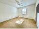 Bright, carpeted bedroom featuring natural light, a ceiling fan, and a neutral color scheme at 307 Running Wind Ln, Maitland, FL 32751