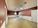 Large bonus room with neutral carpet, white wainscoting, and two ceiling fans at 307 Running Wind Ln, Maitland, FL 32751