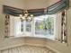 Bright breakfast nook with bay window overlooking the pool and backyard at 307 Running Wind Ln, Maitland, FL 32751