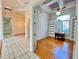 Bright office space with hardwood floors, built-in bookcase, and a view of the front yard at 307 Running Wind Ln, Maitland, FL 32751