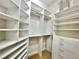 Walk-in closet featuring built-in shelving units and drawers offering ample storage space at 307 Running Wind Ln, Maitland, FL 32751