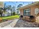 Backyard patio area with outdoor seating, manicured lawn, and storage shed at 33333 Somerset Dr, Leesburg, FL 34788
