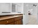 Bathroom with a granite countertop, raised sink, and access to the dining room at 33333 Somerset Dr, Leesburg, FL 34788