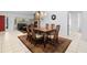 Comfortable dining area with fireplace, stylish chandelier, and seating for Gathering meals at 33333 Somerset Dr, Leesburg, FL 34788
