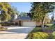 Charming single-story home featuring a well-manicured lawn and a spacious two-car garage at 33333 Somerset Dr, Leesburg, FL 34788