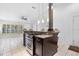 Eat-in kitchen featuring stainless appliances, granite counters and large bar with seating at 33333 Somerset Dr, Leesburg, FL 34788