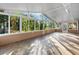 Spacious sunroom with ceiling fan and large windows providing lots of light and views at 33333 Somerset Dr, Leesburg, FL 34788