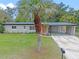 Exterior front elevation showcasing the well-manicured lawn and gray paint at 3518 Shirley Dr, Apopka, FL 32703