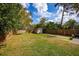 Large backyard with grass, a shed, and wooden fence at 3519 Backspin Ln, Orlando, FL 32804
