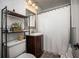 Bathroom featuring a shower with a white curtain and mosaic tile walls at 3519 Backspin Ln, Orlando, FL 32804