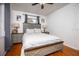 Bedroom with a bed in front of a window and nightstands on each side at 3519 Backspin Ln, Orlando, FL 32804