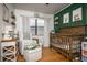 Cozy Bedroom with crib, chair, and decor; a sweet, inviting space at 3519 Backspin Ln, Orlando, FL 32804