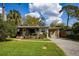 Charming single-story home with a brick driveway, covered porch, and lush green lawn at 3519 Backspin Ln, Orlando, FL 32804
