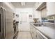 Functional kitchen with stainless steel appliances and ample counter space at 3519 Backspin Ln, Orlando, FL 32804