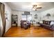 Cozy living room with hardwood floors, comfortable seating, and bright ceiling fan at 3519 Backspin Ln, Orlando, FL 32804