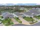 Aerial shot showcases homes with pristine landscaping in a tranquil neighborhood near a picturesque lake at 4009 Swan Goose Ct, Okahumpka, FL 34762