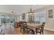 Cozy dining area with hardwood floors, adjacent to living room and patio entrance at 4009 Swan Goose Ct, Okahumpka, FL 34762