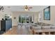 Bright living room with sliding glass doors leading to an outdoor patio area at 4009 Swan Goose Ct, Okahumpka, FL 34762