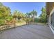 Expansive back yard with mature landscaping and wood deck is perfect for entertaining at 4249 Kendrick Rd, Orlando, FL 32804