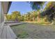 This spacious backyard features a lush lawn and a large wooden deck, perfect for outdoor entertaining at 4249 Kendrick Rd, Orlando, FL 32804