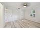 Neutral bedroom with bright windows, white doors and a ceiling fan at 4249 Kendrick Rd, Orlando, FL 32804