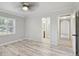 Bedroom featuring a ceiling fan, light grey walls, and wood-look flooring at 4249 Kendrick Rd, Orlando, FL 32804