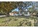 Charming single-story home with a well-maintained front yard, mature tree and inviting curb appeal at 4249 Kendrick Rd, Orlando, FL 32804