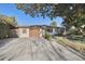 Charming single-story home with a well-maintained front yard, attached garage and inviting curb appeal at 4249 Kendrick Rd, Orlando, FL 32804