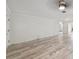 Spacious living room featuring wood-look floors and neutral tones, illuminated by recessed lighting and natural light at 4249 Kendrick Rd, Orlando, FL 32804
