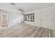 Bright, airy living room featuring wood-look floors and a ceiling fan, creating a warm and inviting space at 4249 Kendrick Rd, Orlando, FL 32804