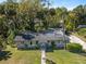 Birds-eye view of home on a landscaped lot surrounded by mature trees at 430 S Virginia Ave, Sanford, FL 32771